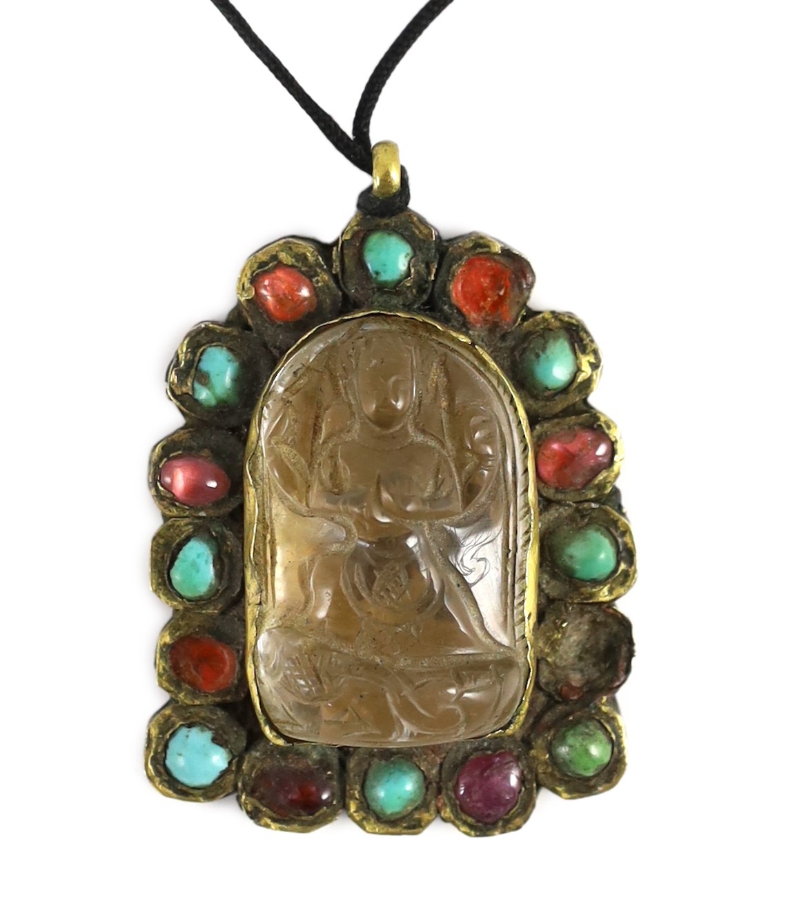 A Tibetan rock crystal and gem set pendant, 19th century, 5.8cm including suspension loop, slight damage